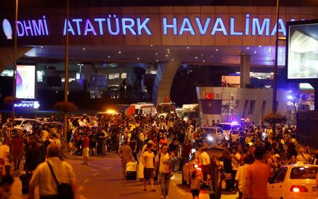 People leave Turkey's largest airport, Istanbul Ataturk, Turkey, following a blast June 28, 2016. REUTERS/Osman Orsal