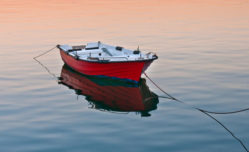 A small empty boat in the water