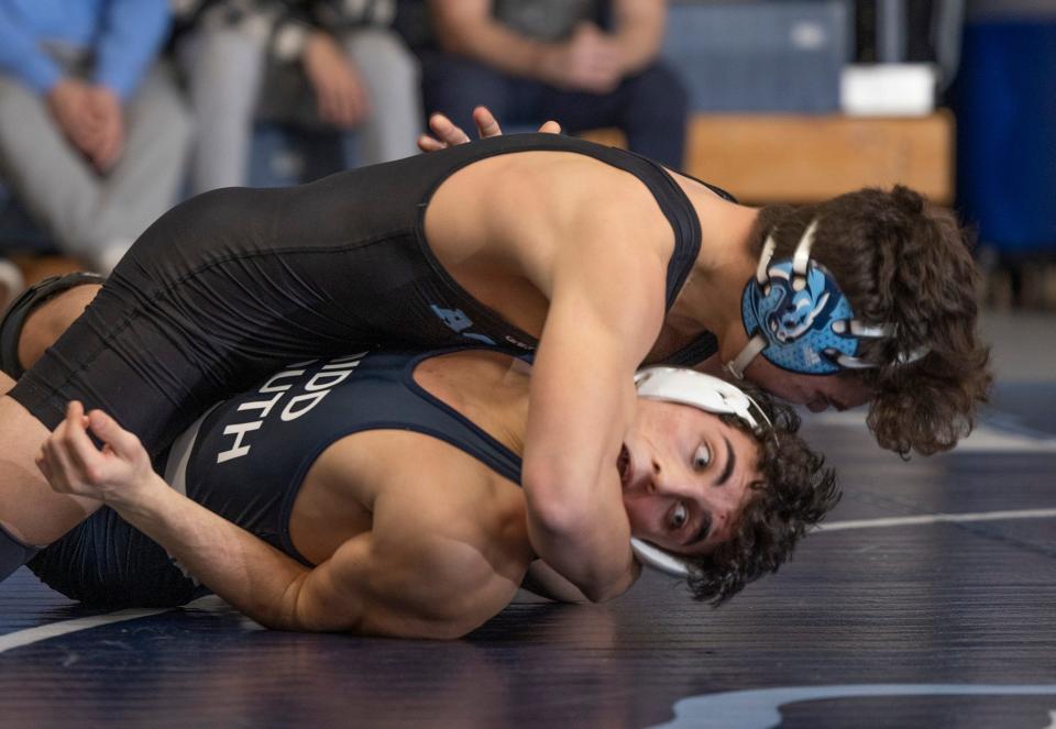 Christian Brothers Academy's Nick Stump (top) is shown riding Middletown South's Nick Holland during his 4-0 win Wednesday night. CBA won the match 37-24.