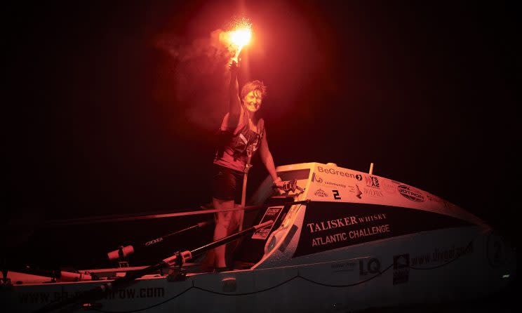 A mother-of-two has rowed her way into the record books, becoming the fastest woman to cross the Atlantic in the history of a gruelling race.