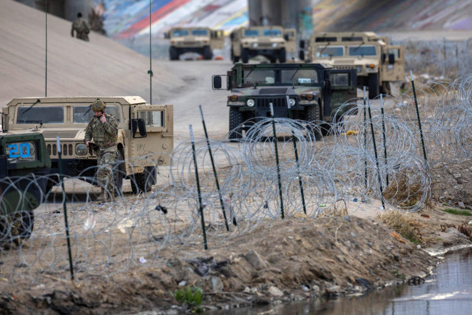 Texas National Guard soldiers stand guard at the U.S.-Mexico border on Jan. 7, 2023, as viewed from Ciudad Juárez, Mexico.  / Credit: John Moore/Getty Images