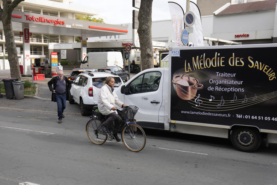 Motorists queue for diesel only at a gas station Wednesday, Oct. 12, 2022 in Arcueil, outside Paris. The French government on Wednesday started the process of requisitioning workers at petrol depots of ExxonMobil's French branch Esso in an attempt to ensure that service stations around the country are supplied with badly needed fuel amid an ongoing strike, saying shortages are becoming "unbearable" to too many in the country.(AP Photo/Francois Mori)