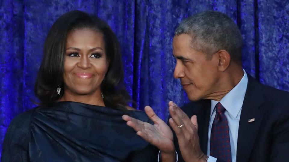 Former U.S. President Barack Obama and first lady Michelle Obama participate in the unveiling of their official portraits during a ceremony at the Smithsonian’s National Portrait Gallery, on February 12, 2018 in Washington, DC. The portraits were commissioned by the Gallery, for Kehinde Wiley to create President Obama’s portrait, and Amy Sherald that of Michelle Obama. (Photo by Mark Wilson/Getty Images)