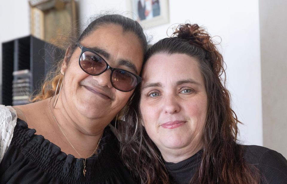 Long-lost sisters Adrienne Lee, left, and Brandy Veltre-Wegeman. Their mom gave Adrienne up for adoption when she was a pregnant teen. It was only after Lee's daughter took a DNA test that they were able to connect.