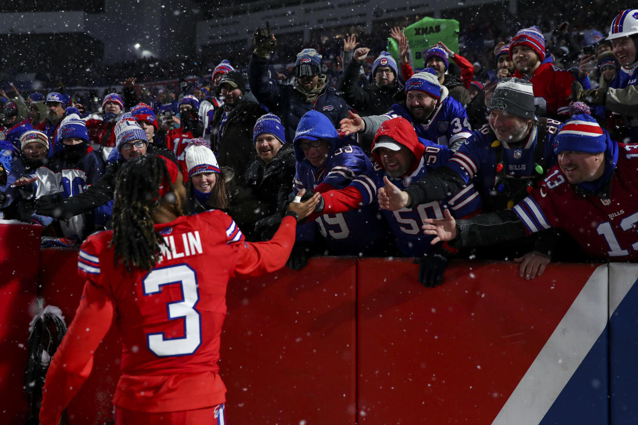 ORCHARD PARK, NY - DECEMBER 17: Damar Hamlin #3 of the Buffalo Bills celebrates with fans after an NFL football game against the Miami Dolphins at Highmark Stadium on December 17, 2022 in Orchard Park, New York. (Photo by Kevin Sabitus/Getty Images)