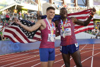 Gold medalist Grant Holloway, of the United States, right, poses with silver medalist Trey Cunningham, of the United States, after a final in the men's 110-meter hurdles the at the World Athletics Championships on Sunday, July 17, 2022, in Eugene, Ore.(AP Photo/Charlie Riedel)