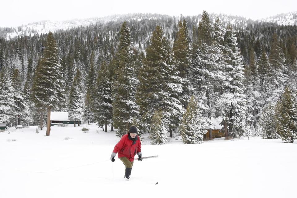 Frank Gehrke, chief of the California Cooperative Snow Surveys Program for the Department of Water Resources, crosses a snow covered meadow as he conducts the first snow survey of the season at Phillips Station Tuesday, Jan. 3, 2017, near Echo Summit, Calif. The survey showed the snowpack at 53 percent of normal for this site at this time of year. (AP Photo/Rich Pedroncelli)