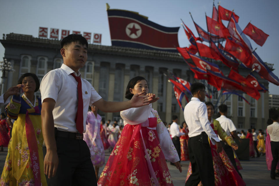 In this Friday, July 27, 2018, file photo, North Koreans take part in a mass dance during the commemoration of the 65th anniversary of the end of the Korean War, which the country celebrates as the day of "victory in the fatherland liberation war," at Kim Il Sung Square in Pyongyang, North Korea. (AP Photo/Dita Alangkara, File)