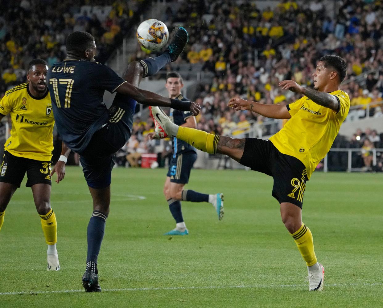 Sept. 30, 2023; Columbus, Oh., USA; 
Philadelphia Union defender Damion Lowe (17) and Columbus Crew forward Cucho Hernandez (9) compete for a ball during the first half of Saturday's match at Lower.com Field in Columbus.