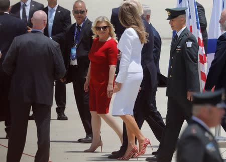 U.S. first lady Melania Trump (center R) walks by Israeli Prime Minister Benjamin Netanyahu's wife Sara upon her arrival at Ben Gurion International Airport in Lod near Tel Aviv, Israel May 22, 2017. REUTERS/Amir Cohen