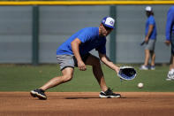 Israel Olympic baseball player Danny Valencia takes fielding practice at Salt River Fields spring training facility, Wednesday, May 12, 2021, in Scottsdale, Ariz. Israel has qualified for the six-team baseball tournament at the Tokyo Olympic games which will be its first appearance at the Olympics in any team sport since 1976. (AP Photo/Matt York)