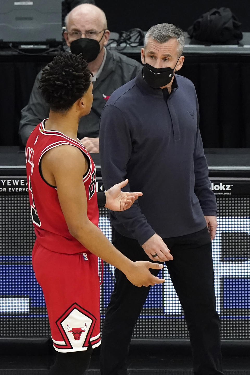 Chicago Bulls head coach Billy Donovan, right, talks with guard Devon Dotson during the first half of an NBA basketball game against the Milwaukee Bucks in Chicago, Sunday, May 16, 2021. (AP Photo/Nam Y. Huh)