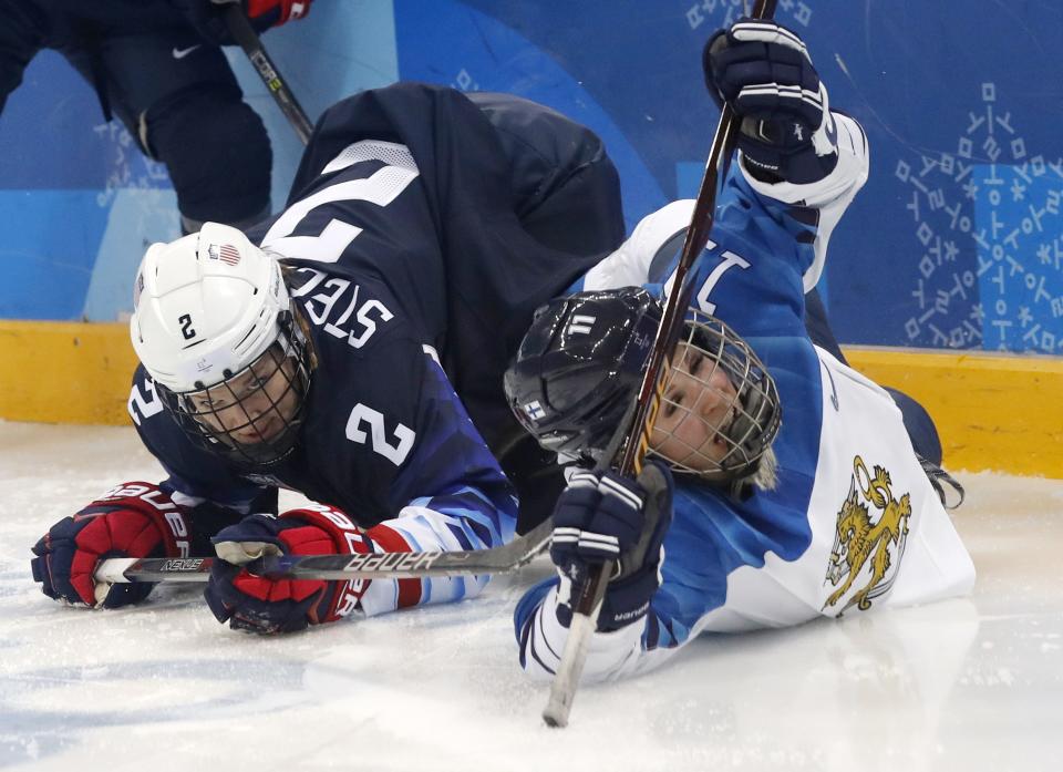 <p>Annina Rajahuhta of Finland (R) reacts after colliding with u2 REUTERS/Kim Kyung-Hoon </p>