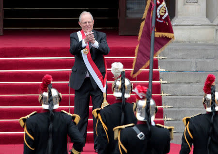 Peru's President Pedro Pablo Kuczynski gestures at the presidential palace after his inauguration ceremony in Lima, Peru, July 28, 2016. REUTERS/Guadalupe Pardo