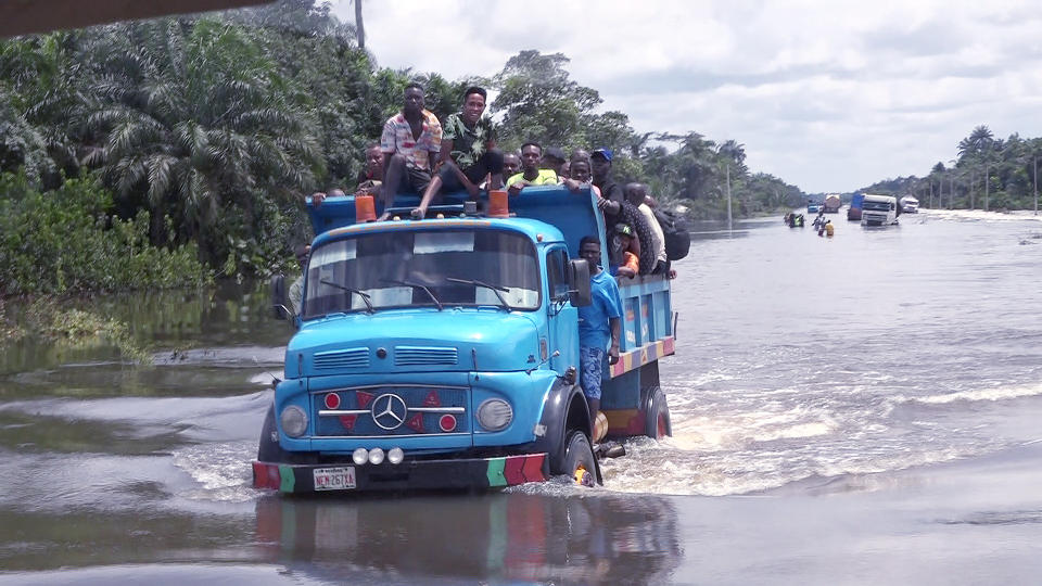 People drive through flooded roads In Bayelsa, Nigeria, Thursday, Oct. 20, 2022. More than 600 people have been killed so far this year and 1.3 million forced from their homes by Nigeria’s worst floods in a decade. Authorities are blaming the disaster on unusually heavy rainfall and the release of excess water from the Lagdo dam in neighboring Cameroon. (AP Photo/Reed Joshua)