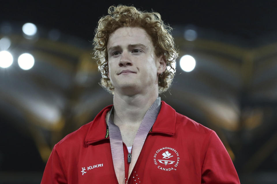 FILE - Men's pole vault silver medalist Canada's Shawnacy Barber is shown on the podium at Carrara Stadium during the 2018 Commonwealth Games on the Gold Coast, Australia, Thursday, April 12, 2018. Barber has died from medical complications. He was 29. Barber died Wednesday, Jan. 17, 2024, at home in Kingwood, Texas, his agent, Paul Doyle, confirmed to The Associated Press. (AP Photo/Mark Schiefelbein, File)