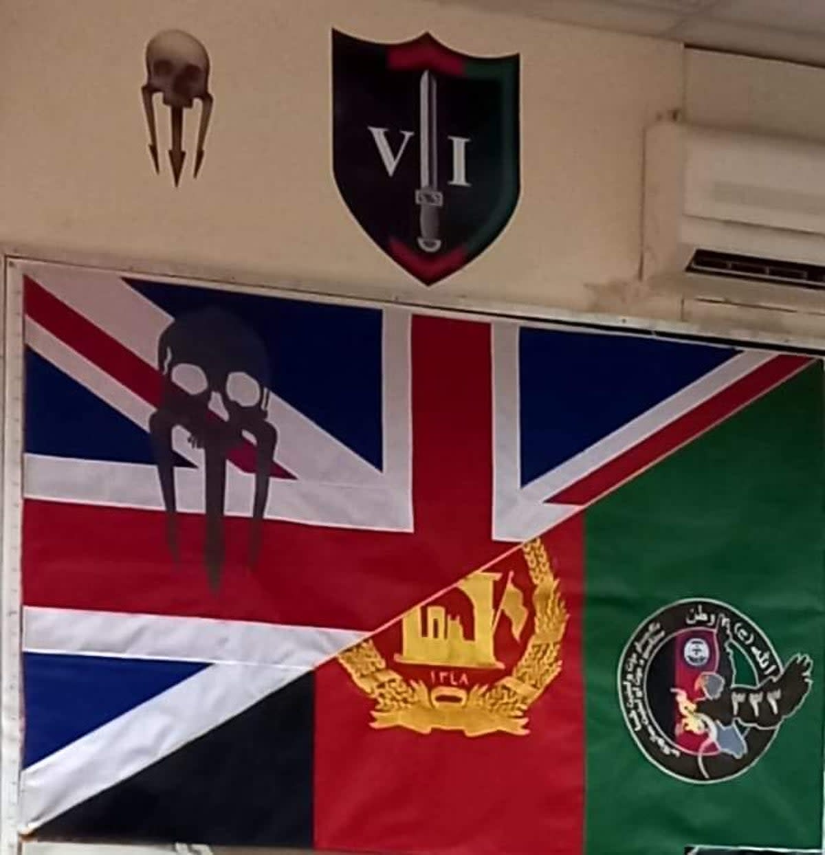A picture of a union jack and an Afghan flag sewn together and hung in the British mentors’ mess hall at the CF333 base in Logar province (Supplied)