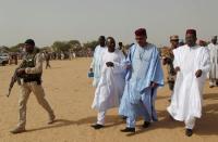 Niger's Interior Minister Mohamed Bazoum (2nd from R) walks with members of his delegation at the Boudouri site for displaced persons outside the town of Diffa, in southeastern Niger, June 18, 2016. REUTERS/Luc Gnago