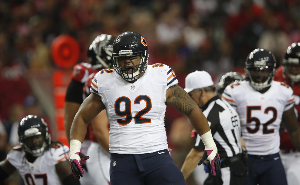 FILE - Chicago Bears defensive tackle Stephen Paea (92) reacts to helping on a sack of Atlanta Falcons quarterback Matt Ryan (2) during the first half of an NFL football game, Sunday, Oct. 12, 2014, in Atlanta. Paea was the top performer in the bench press at the NFL scouting combine in 2015. (AP Photo/Brynn Anderson, File)