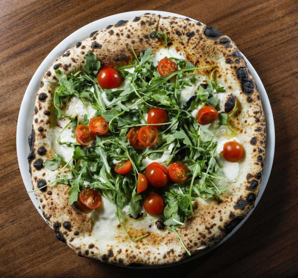 Among the pizza offerings at Flour House in San Luis Obispo is the pizza bianca-style Primavera, topped with mozzarella di bufala, tomatoes and arugula.