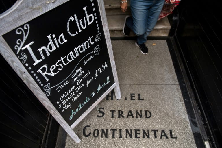 A blackboard stands at the entrance to the India Club restaurant in London on October 16, 2017