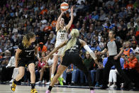 Indiana Fever guard Caitlin Clark (22) puts up a 3-point shot to score against the Connecticut Sun during the fourth quarter of a WNBA basketball game, Tuesday, May 14, 2024, in Uncasville, Conn. (AP Photo/Jessica Hill)