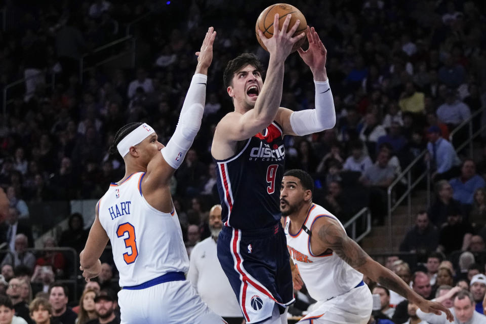 Washington Wizards' Deni Avdija (9) drives past New York Knicks' Trevor Keels (3) during the second half of an NBA basketball game Sunday, April 2, 2023, in New York. The Knicks won 118-109. (AP Photo/Frank Franklin II)