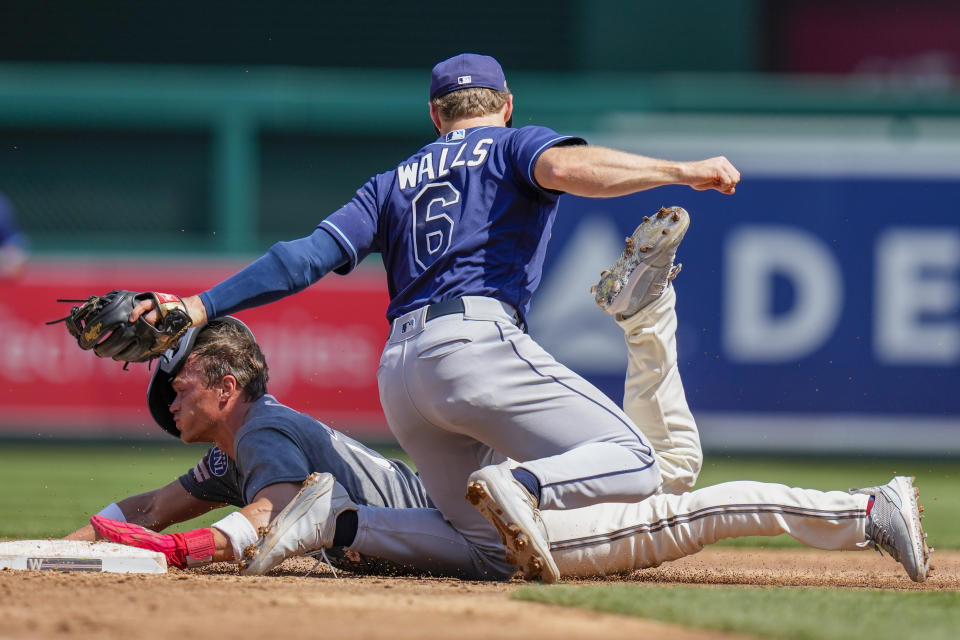 Tampa Bay Rays second baseman Taylor Walls tags out Washington Nationals' Alex Call on a steal attempt of second base during the third inning of a baseball game at Nationals Park, Wednesday, April 5, 2023, in Washington. (AP Photo/Alex Brandon)