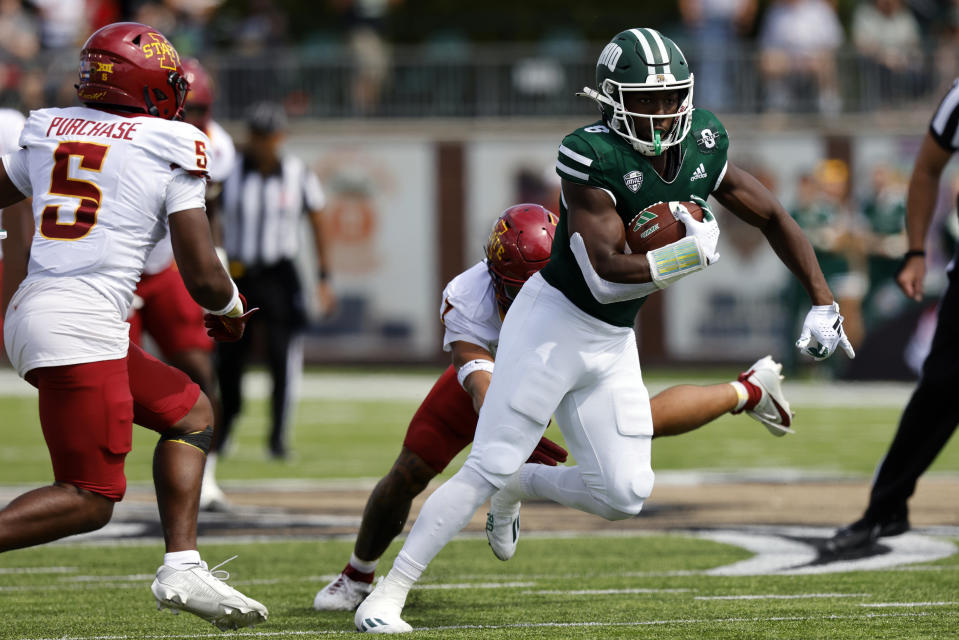 Ohio wide receiver Jacoby Jones, right, gets past Iowa State defensive back Malik Verdon, center, and defensive back Myles Purchase during an NCAA college football game Saturday, Sept. 16, 2023 in Athens, Ohio. (AP Photo/Paul Vernon)