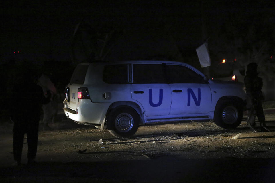 Afghan security personnel arrive at the site of explosion in Kabul, Afghanistan, Sunday, Nov. 24, 2019. An Afghan official said a blast in that capital Kabul targeting a United Nations vehicle has left at least 1 person dead. Nasrat Rahimi, spokesman for the Interior Ministry, said several others were wounded in the attack. (AP Photo/Rahmat Gul)