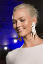 <p><i>Karlie Kloss wears ivory-colored horse-shaped earrings from the SS18 Brandon Maxwell collection. (Photo: ImaxTree) </i></p>