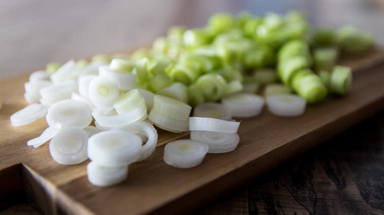 chopped green onions on chopping board