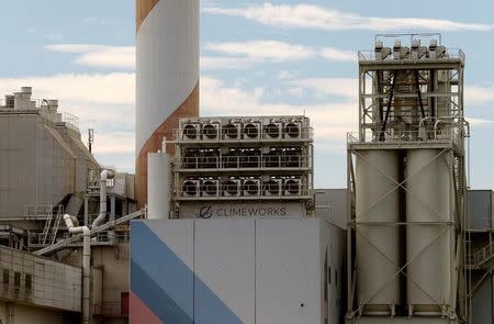 A facility for capturing CO2 from air of Swiss Climeworks AG is placed on the roof of a waste incinerating plant in Hinwil, Switzerland July 18, 2017. Picture taken July 18, 2017. REUTERS/Arnd Wiegmann