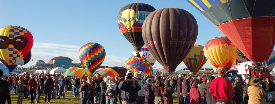 In this Oct. 8, 2011 photo, hot air balloons are shown at the Albuquerque International Balloon Fiesta before take off. The 41st annual event is set to begin Saturday and is expected to draw hundreds of thousands of spectators from around the country and the global. (AP Photo/Russell Contreras)