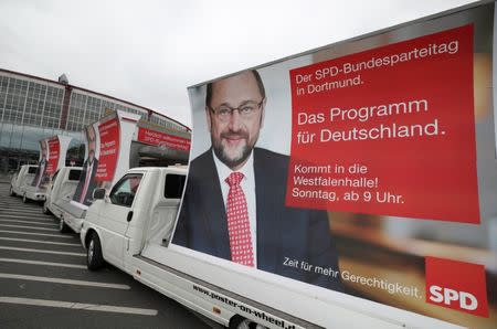 Electoral posters on wheels of Chancellor candidate Martin Schulz of the Social Democratic party SPD are seen prior to a SPD party convention in Dortmund, Germany, June 24, 2017. REUTERS/Wolfgang Rattay