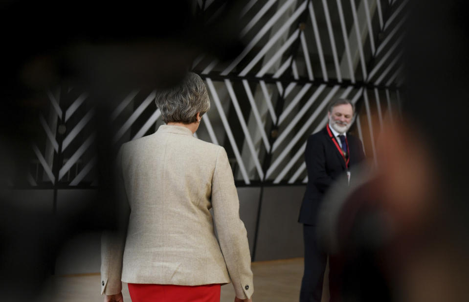 British Prime Minister Theresa May walks away after speaking with the press on arrival for an EU summit at the Europa building in Brussels, Tuesday, May 28, 2019. European Union leaders are meeting in Brussels to haggle over who should lead the 28-nation bloc's key institutions for the next five years after weekend elections shook up Europe's political landscape. (AP Photo/Riccardo Pareggiani)