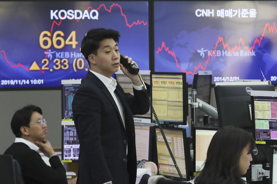 A currency trader talks on the phone at the foreign exchange dealing room of the KEB Hana Bank headquarters in Seoul, South Korea, Thursday, Nov. 14, 2019. Asian stock markets were mixed Thursday amid doubts about the status of a U.S.-Chinese trade deal after the U.S. Federal Reserve’s chairman said it is likely to leave its benchmark interest rate unchanged. (AP Photo/Ahn Young-joon)