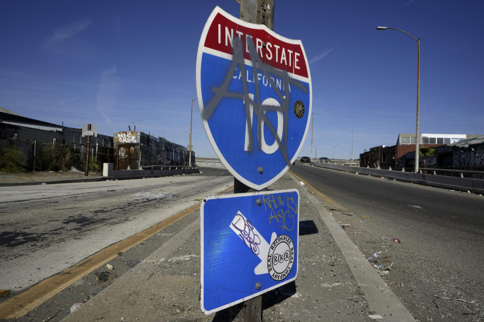 A ramp to Interstate 10 is seen in Los Angeles, Tuesday, Nov. 14, 2023. California Gov. Gavin Newsom says a stretch of I-10 in Los Angeles that was burned in an act of arson does not need to be demolished, and that repairs will take an estimated three to five weeks. (AP Photo/Damian Dovarganes)