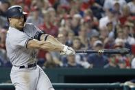 Jun 18, 2018; Washington, DC, USA; New York Yankees left fielder Giancarlo Stanton (27) hits an RBI double against the Washington Nationals in the seventh inning at Nationals Park. Mandatory Credit: Geoff Burke-USA TODAY Sports