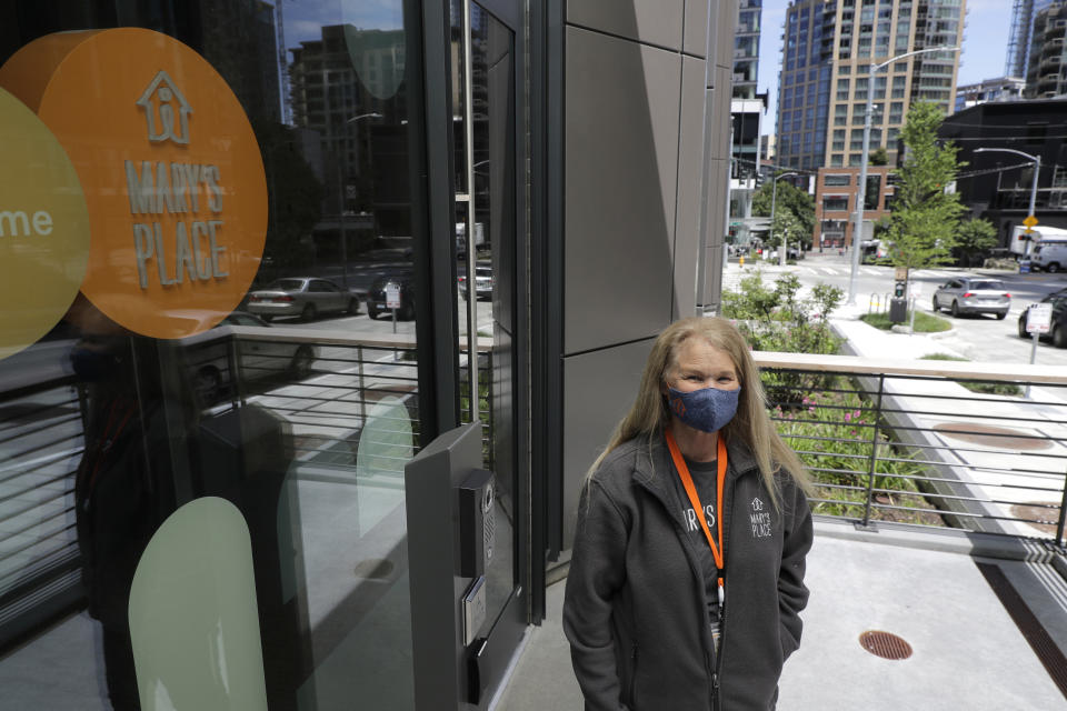 Marty Hartman, executive director of Mary's Place, a family homeless shelter located inside an Amazon corporate building, poses for a photo, Wednesday, June 17, 2020, in Seattle. The facility is home to the Popsicle Place shelter program, an initiative to address the needs of homeless children with life-threatening health conditions. (AP Photo/Ted S. Warren)