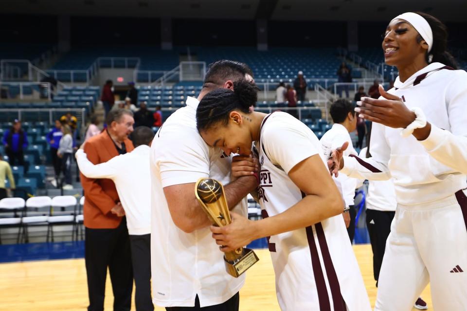 Mississippi State women's basketball assistant coach Gabe Lazo and guard Jerkaila Jordan embrace after a win vs. Tulsa on Nov. 26, 2023.