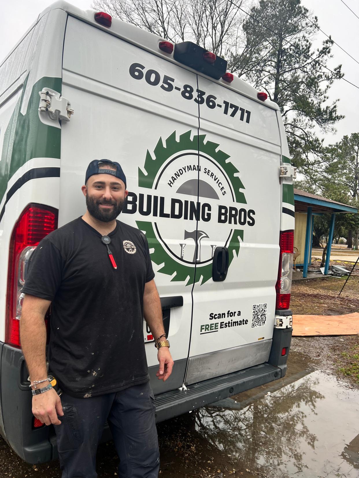 Mike Re, an Aberdeen handyman and founder of Building Bros, stands in front of a van on Friday, Jan. 26, 2024. Re is competing to win a $40,000 cash prize on "Cabin Wars: Flip It To Win It," a reality renovation show set in Robert, Louisiana.