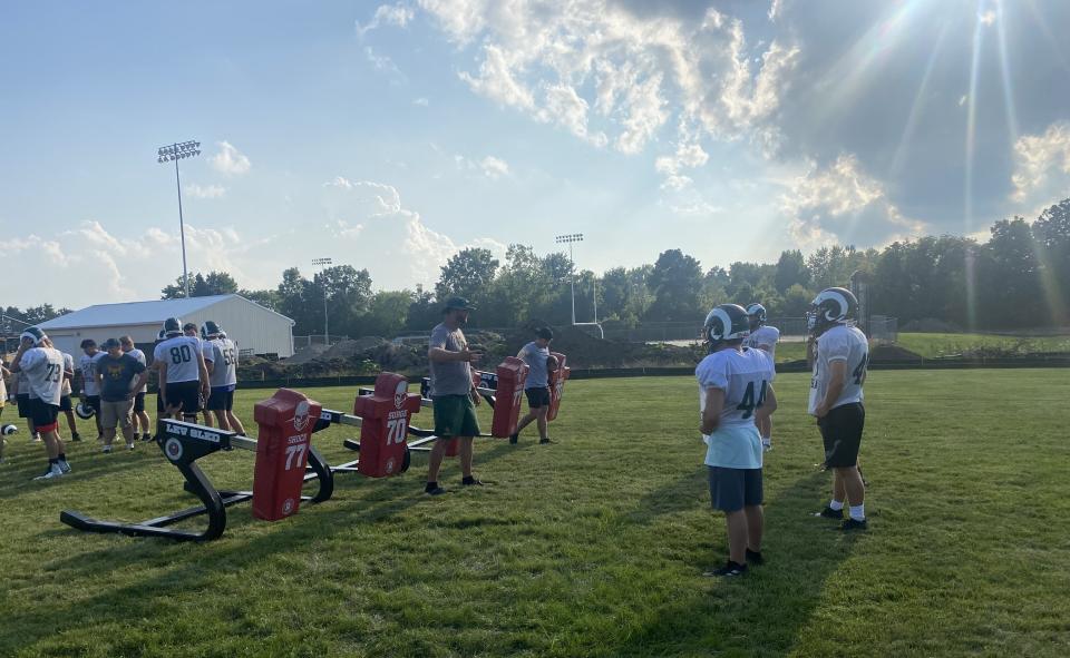 Flat Rock players get ready to hit the blocking sled during a recent football practice.