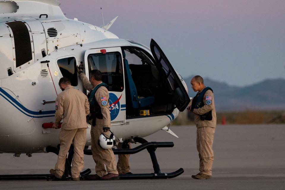 Team members prepare to board a helicopter to collect the capsule containing a sample collected from the Bennu asteroid as part of NASA’s Osiris-Rex mission at the U.S. Army’s Dugway Proving Ground in Dugway on Sunday, Sept. 24, 2023. | Megan Nielsen, Deseret News