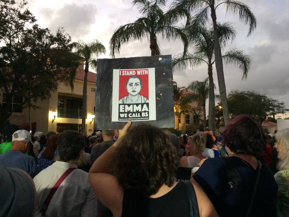 <p>A protester holds up a sign during a rally to protest the sale of assault rifles in the wake of the Parkland Shooting at City Hall in Delray Beach, Fla., on Feb. 19, 2018. (Photo: Mindy Katzman/Yahoo News) </p>