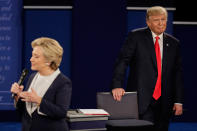 <p>Republican presidential nominee Donald Trump listens as Democratic presidential nominee Hillary Clinton answers a question during the second presidential debate at Washington University in St. Louis, Mo., Sunday, Oct. 9, 2016. (Photo: Julio Cortez/AP) </p>