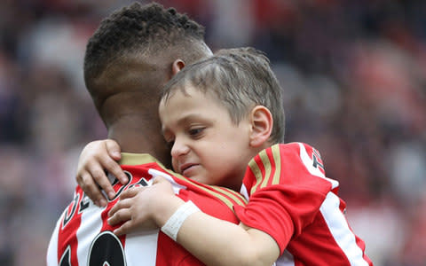  Jermain Defoe of Sunderland and Bradley Lowery are seen walking out prior to the Premier League match between Sunderland and Swansea City at Stadium of Light on May 13, 2017 in Sunderland - Credit:  Getty Images Europe