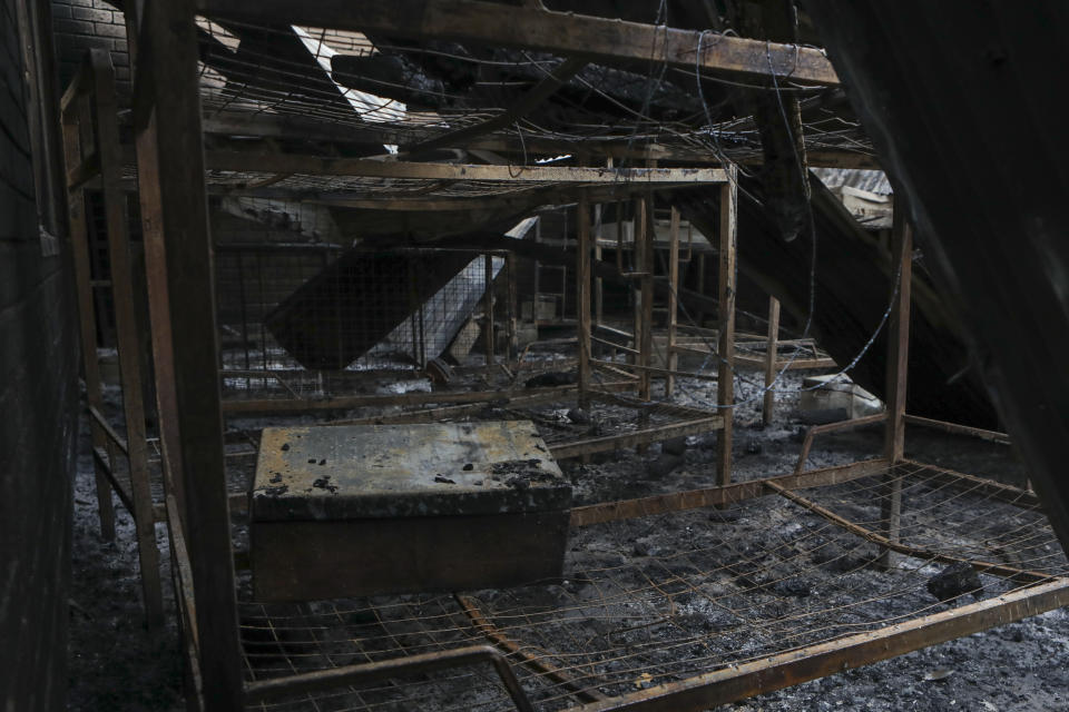 A dormitory destroyed by fire is seen inside the Lhubiriha Secondary School following Saturday's attack on the school in Mpondwe, Uganda Sunday, June 18, 2023, near the border with Congo. Ugandan authorities have recovered the bodies of 41 people including 38 students who were burned, shot or hacked to death after suspected rebels attacked the school, according to the local mayor. (AP Photo/Hajarah Nalwadda)