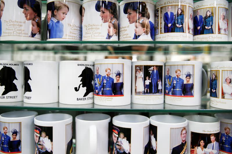 Merchandise depicting Britain's Prince Harry and Meghan, Duchess of Sussex, are seen on display in a souvenir shop near Buckingham Palace in London