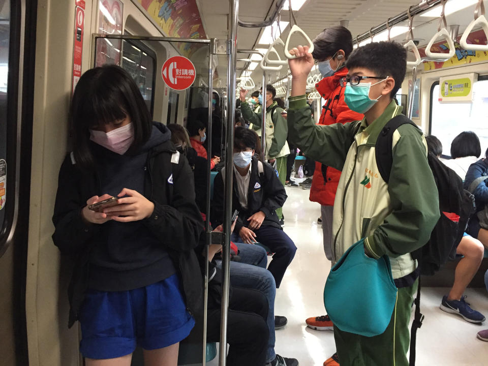 Image: Commuters travel on the subway in Taiwan. (Cindy Sui / NBC News)